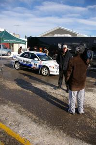 Jonathan Bottoms is interviewed in front of his Subaru WRX in Lewiston prior to the start. Carolyn Bosley was his navigator.