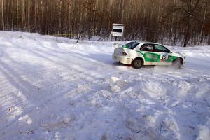 Seamus Burke / Jason Gillespie Mitsubishi Lancer Evo 8 exit a right-hander on SS1.