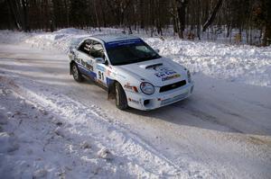 Jonathan Bottoms / Carolyn Bosley Subaru WRX at a 90-right on SS1.