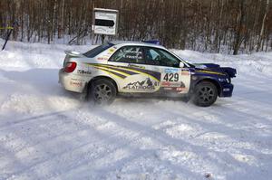 Tanner Foust / Scott Crouch Subaru WRX exits a right-hander on SS1 of the event.