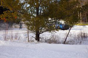 Mark Utecht / Rob Bohn almost can't be seen executing a perfect hairpin in their Subaru WRX.