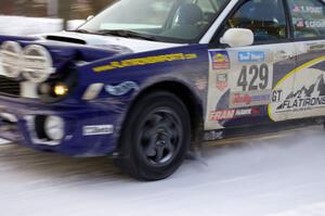 Tanner Foust / Scott Crouch Subaru WRX rockets down a straight on the ranch stage on day one.