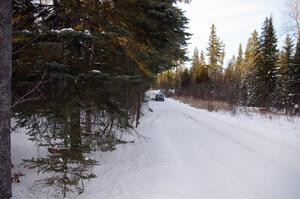 Tom Ottey / Pam McGarvey Mazda 323GTX at speed on a straight on the ranch stage.