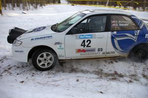 Eric Burmeister / Dave Shindle	Mazda Protege MP3 at a hairpin on the ranch stage.