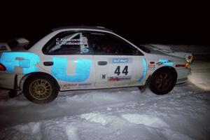 The Henry Krolikowski / Cindy Krolikowski Subaru WRX drifts through the first corner of the evening running of the ranch stage.