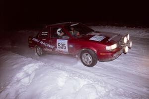 The Jake Himes / Matt Himes Nissan Sentra SE-R drifts through the first corner of the evening running of the ranch stage.