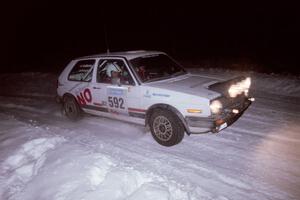 The Justin Pritchard / Kim DeMotte VW Golf drifts through the first corner of the evening running of the ranch stage.