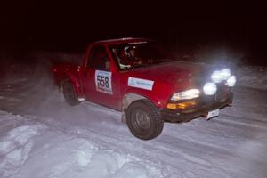 The Jim Cox / Mark Larson Chevy S-10 drifts through the first corner of the evening running of the ranch stage.