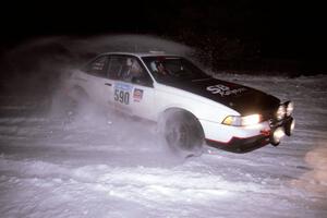 The Joel Sanford / Jeff Hribar Chevy Cavalier drifts through the first corner of the evening running of the ranch stage.