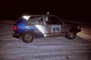 The Russ Rosendale / Pete Oppelt VW Golf drifts through the first corner of the evening running of the ranch stage.