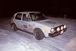 The Brett Fairbanks / Chris Greenhouse VW Rabbit drifts through the first corner of the evening running of the ranch stage.