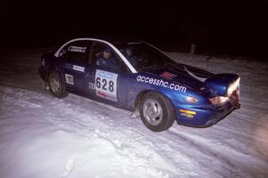 The Dan Adamson / Jason Takkunen Saturn SL2 drifts through the first corner of the evening running of the ranch stage.