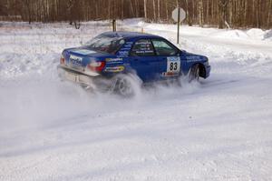 Mark Utecht / Rob Bohn prepare for a 90-left on the first stage of day two in their Subaru WRX.