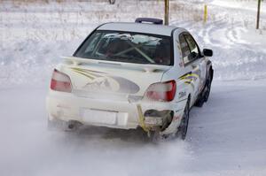 Tanner Foust / Scott Crouch Subaru WRX sets up for a 90-left on the first stage of day two of the rally.