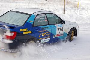 Otis Dimiters / Peter Monin Subaru WRX STi on the first stage of day two of the rally.