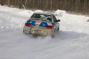 Henry Krolikowski / Cindy Krolikowski blast through a left-hander on the first stage of day two in their Subaru WRX.