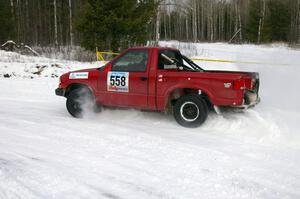 Jim Cox / Mark Larson Chevy S-10 powers out of a left-hander on the first stage of day two.