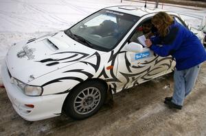 Tara McMann interviews Matt Iorio / Ole Holter after they moved into second place in their Subaru Impreza.