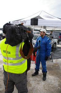 Navigator Ole Holter is interviewed in front of the Subaru Impreza that he shared with driver Matt Iorio.