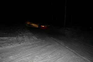 A car crosses the finish of Hungry 5 at night.