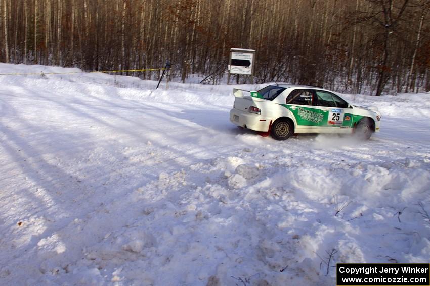 Seamus Burke / Jason Gillespie Mitsubishi Lancer Evo 8 exit a right-hander on SS1.