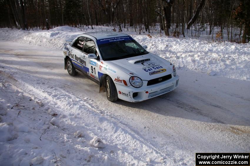 Jonathan Bottoms / Carolyn Bosley Subaru WRX at a 90-right on SS1.