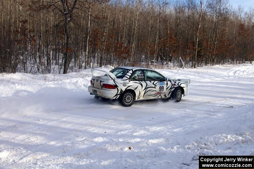 Matt Iorio / Ole Holter	Subaru Impreza exits out of a right-hander on SS1.