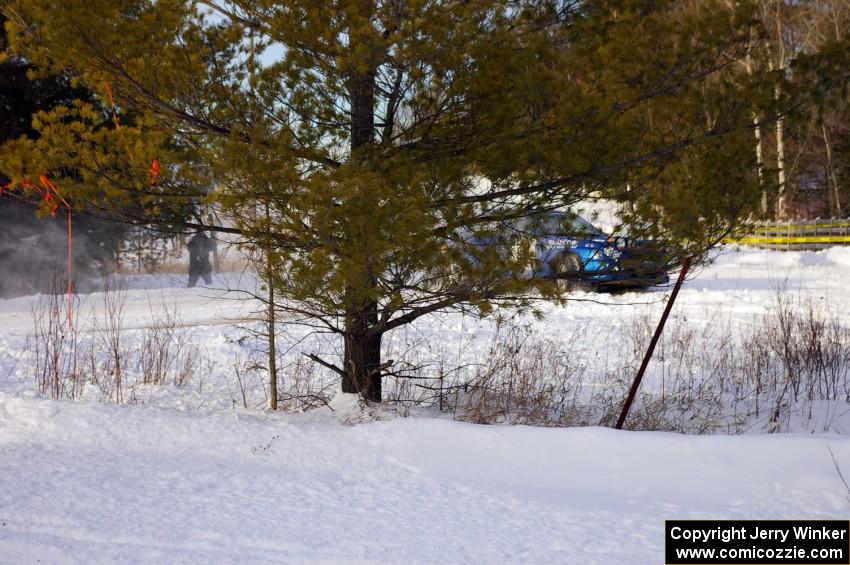 Mark Utecht / Rob Bohn almost can't be seen executing a perfect hairpin in their Subaru WRX.