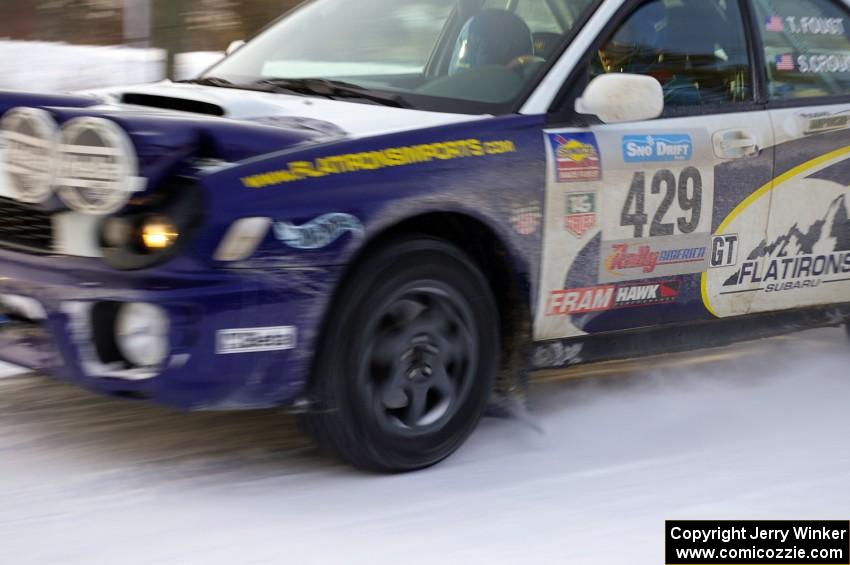 Tanner Foust / Scott Crouch Subaru WRX rockets down a straight on the ranch stage on day one.