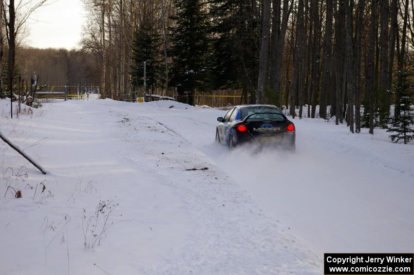 Chris Whiteman / Mike Rossey blast down a straight at the ranch stage in their Dodge SRT-4 .