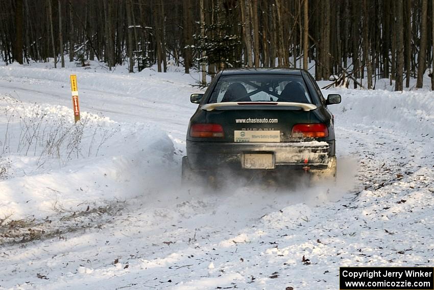 Mark Podoluch / Kazimierz Pudelek Subaru Impreza nail a slippery hairpin on the ranch stage beautifully.