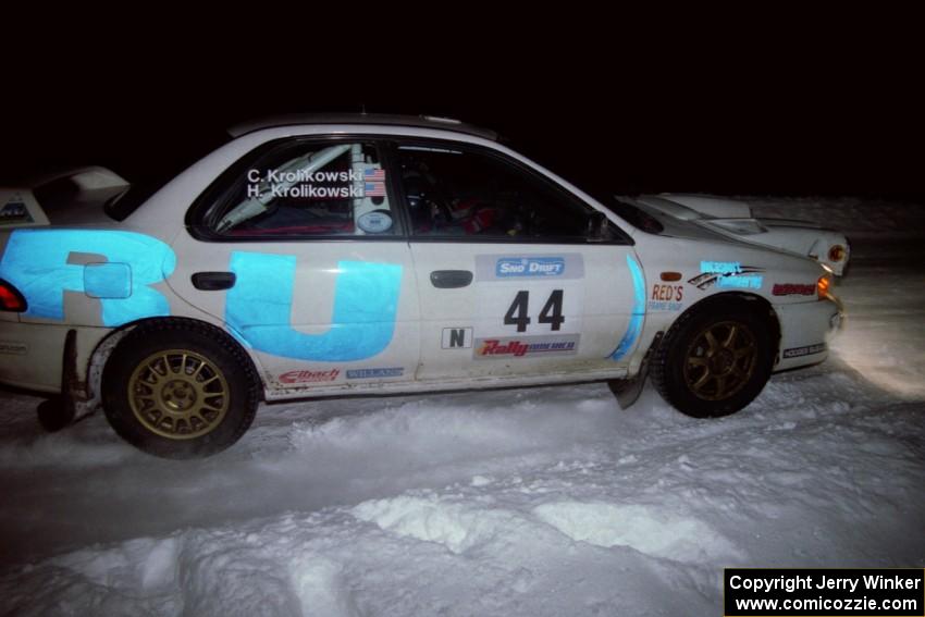 The Henry Krolikowski / Cindy Krolikowski Subaru WRX drifts through the first corner of the evening running of the ranch stage.