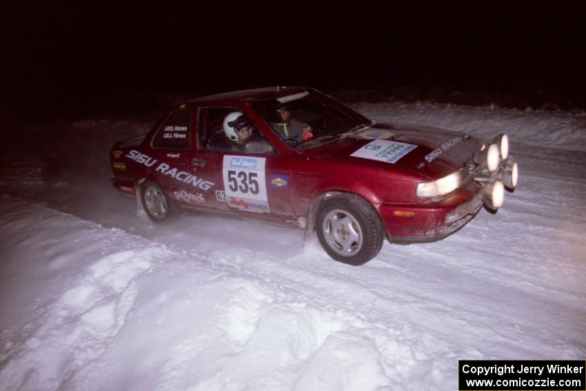 The Jake Himes / Matt Himes Nissan Sentra SE-R drifts through the first corner of the evening running of the ranch stage.