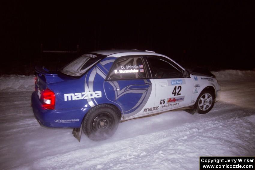 The Eric Burmeister / Dave Shindle Mazda Protege MP3 drifts through the first corner of the evening running of the ranch stage.