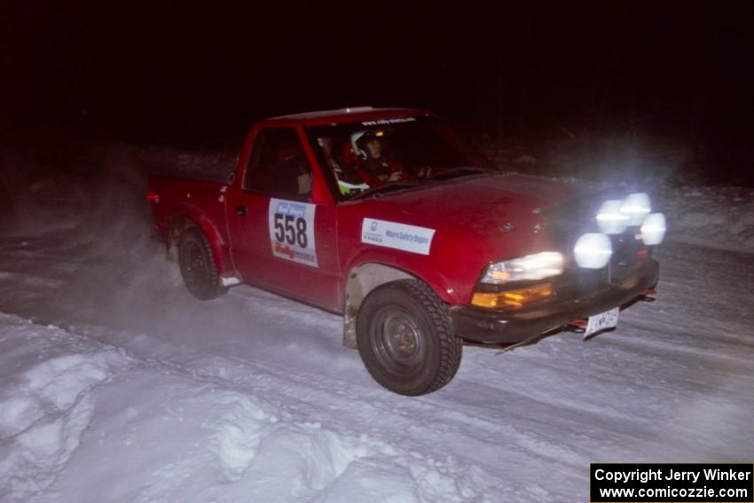 The Jim Cox / Mark Larson Chevy S-10 drifts through the first corner of the evening running of the ranch stage.