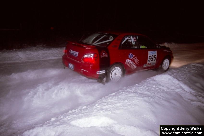 The John Cirisan / Josh Hamacher Subaru WRX drifts through the first corner of the evening running of the ranch stage.