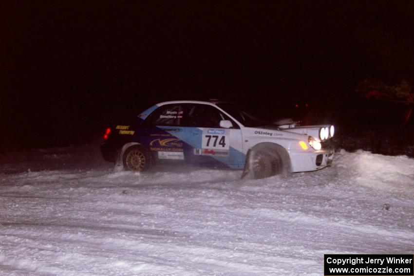 The Otis Dimiters / Peter Monin Subaru WRX STi drifts wide and nearly stuffs it through the first corner of the ranch stage.