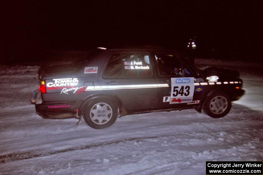 The Mike Merbach / Jeff Feldt VW Jetta drifts through the first corner of the evening running of the ranch stage.
