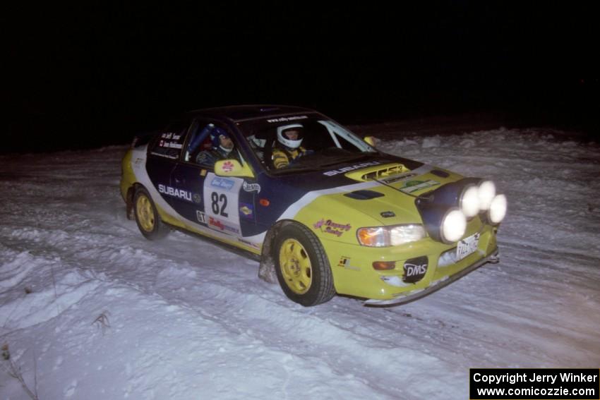 The Joan Hoskinson / Jeff Secor Subaru Impreza 2.5RS drifts through the first corner of the evening running of the ranch stage.