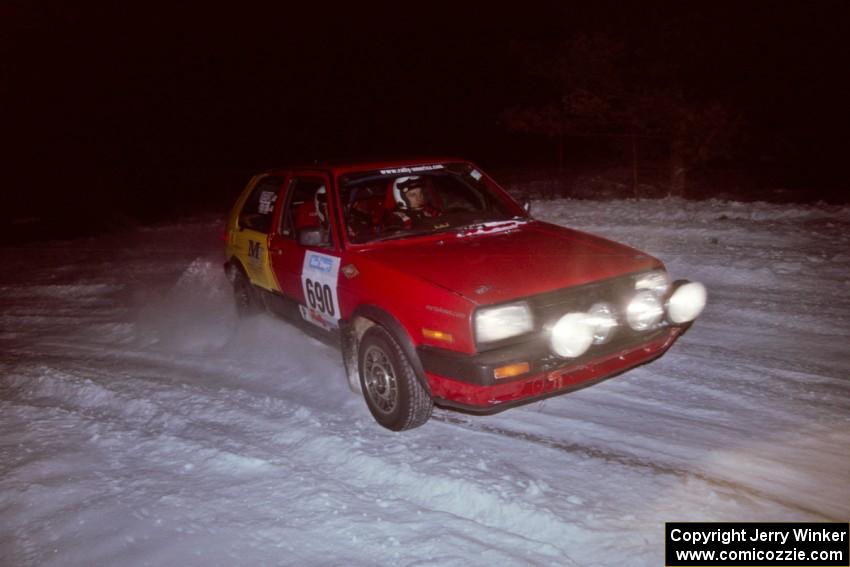 The Carl Seidel / Eric Iverson VW Golf drifts through the first corner of the evening running of the ranch stage.