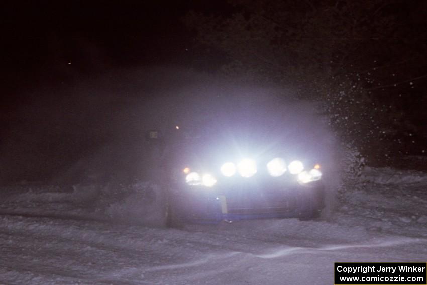 The Ken Block / Christian Edstrom Subaru WRX STi drifts wide through the first corner of the evening running of the ranch stage.