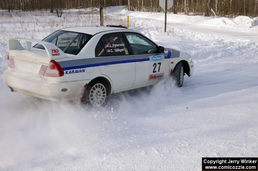 Chris Gilligan / Joe Petersen set up for a 90-left on the first stage of day two in their Mitsubishi Lancer Evo IV.