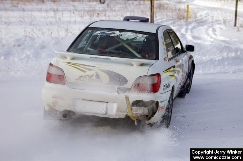 Tanner Foust / Scott Crouch Subaru WRX sets up for a 90-left on the first stage of day two of the rally.