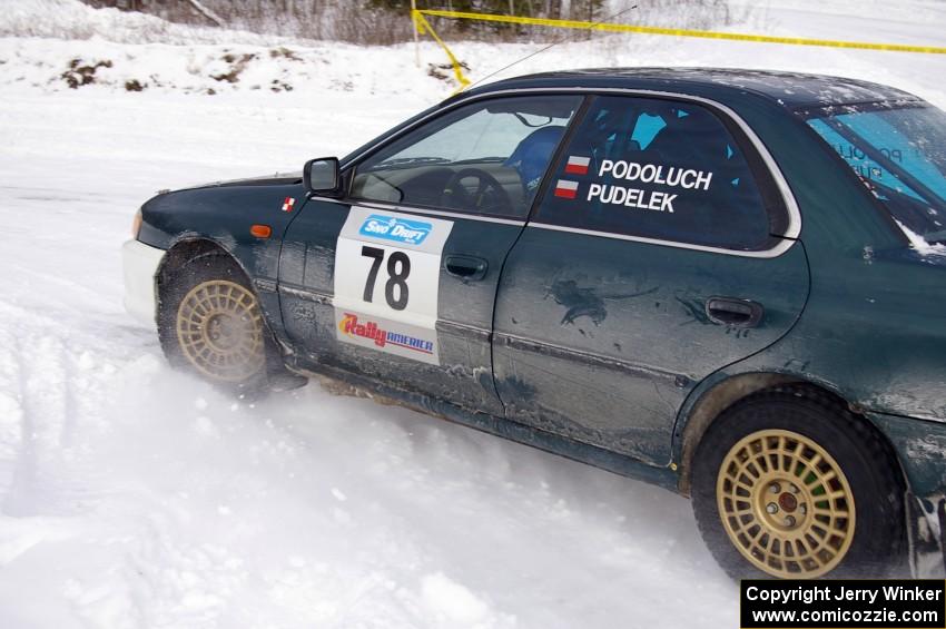 Mark Podoluch / Kazimierz Pudelek Subaru Impreza exit out of a tight left-hander on day two of the rally.