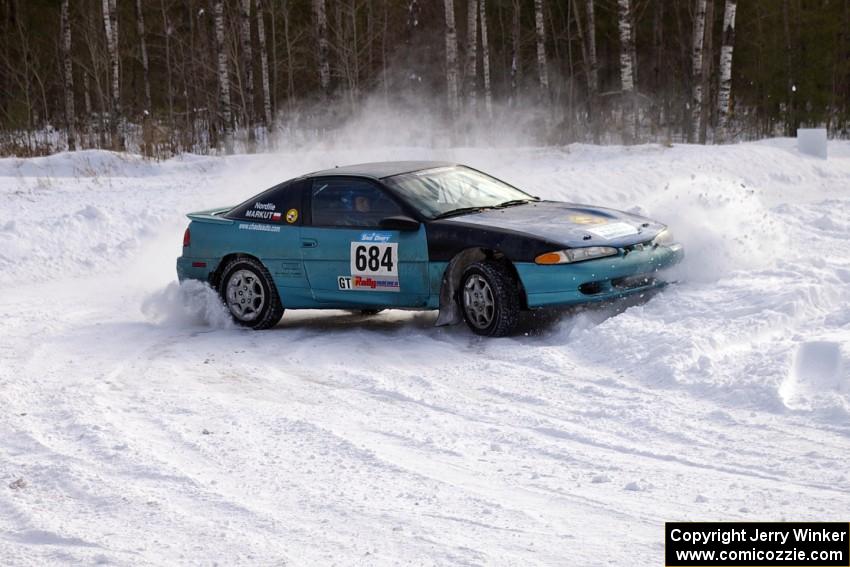 Adam Markut / John Nordlie Eagle Talon clip the inside of a bank on the first stage of day one.