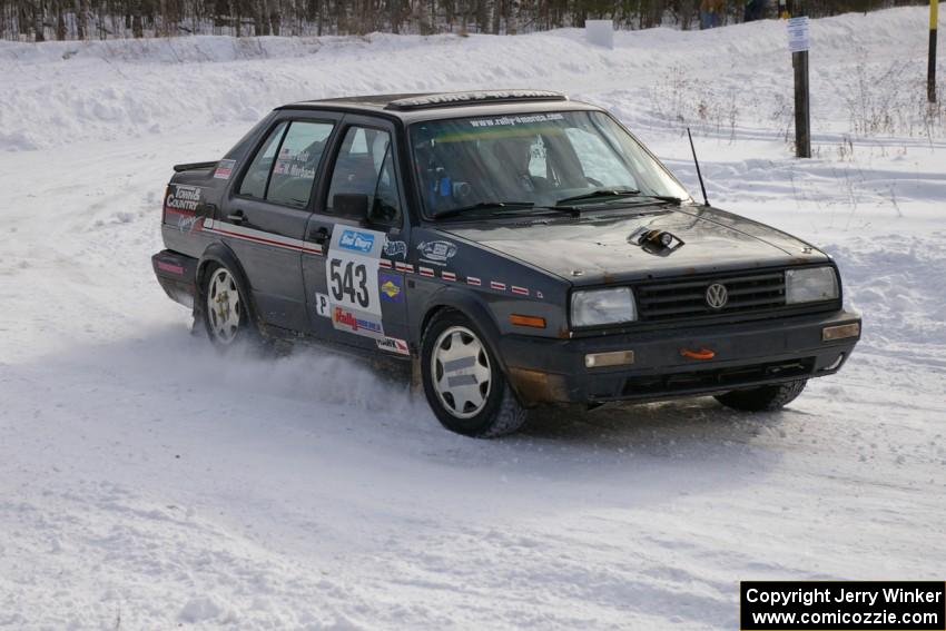 Mike Merbach / Jeff Feldt VW Jetta at a 90-left on the first stage of day two.