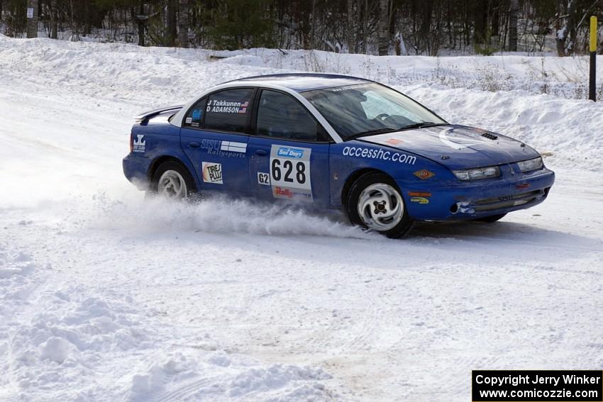 Dan Adamson / Jason Takkunen Saturn SL2 at a 90-left on day two of the rally.