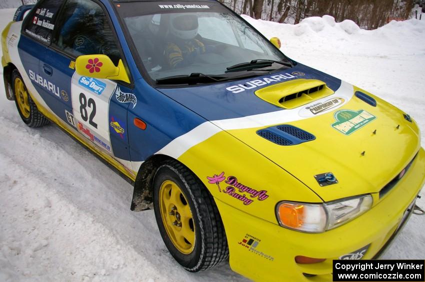 Joan Hoskinson / Jeff Secor Subaru Impreza 2.5RS hugs the inside of a bank on day two of the rally.