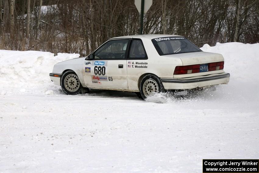 Greg Woodside / Tom Woodside get the back end loose on a right-hander in their Dodge Shadow.