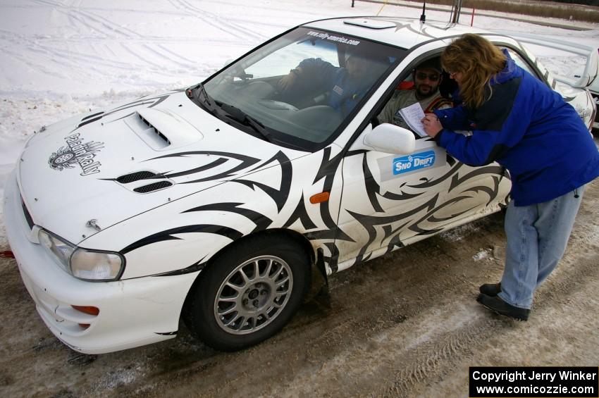 Tara McMann interviews Matt Iorio / Ole Holter after they moved into second place in their Subaru Impreza.